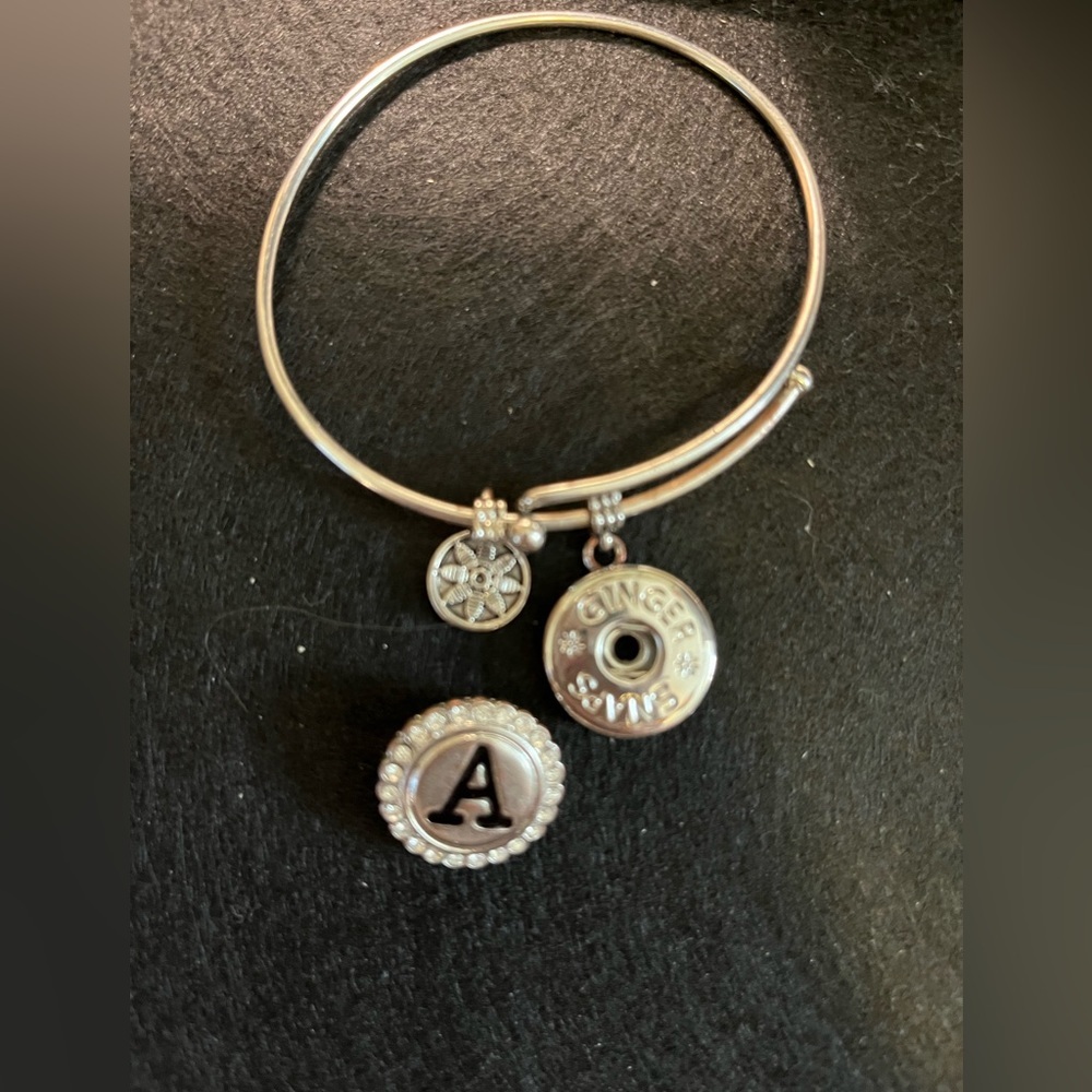 Ginger Snap Silver Charm bracelet with initial “A”.